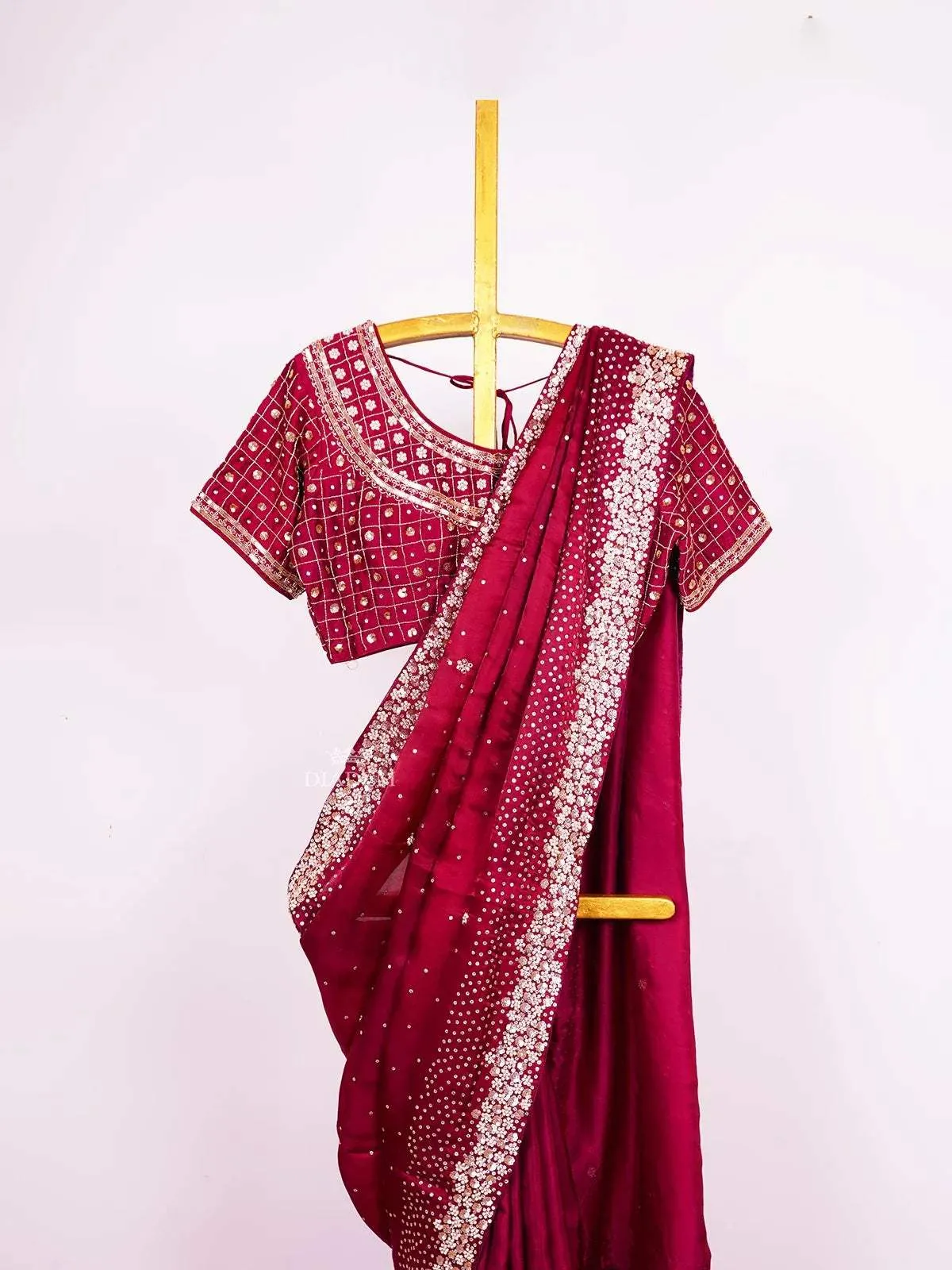 Burgundy Satin Crepe Saree with Sequins and Beads Embellished Border paired with Designer Blouse