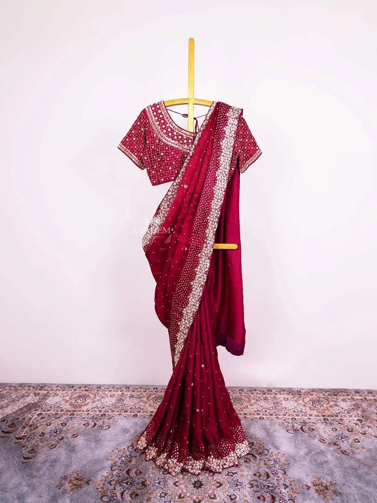 Burgundy Satin Crepe Saree with Sequins and Beads Embellished Border paired with Designer Blouse