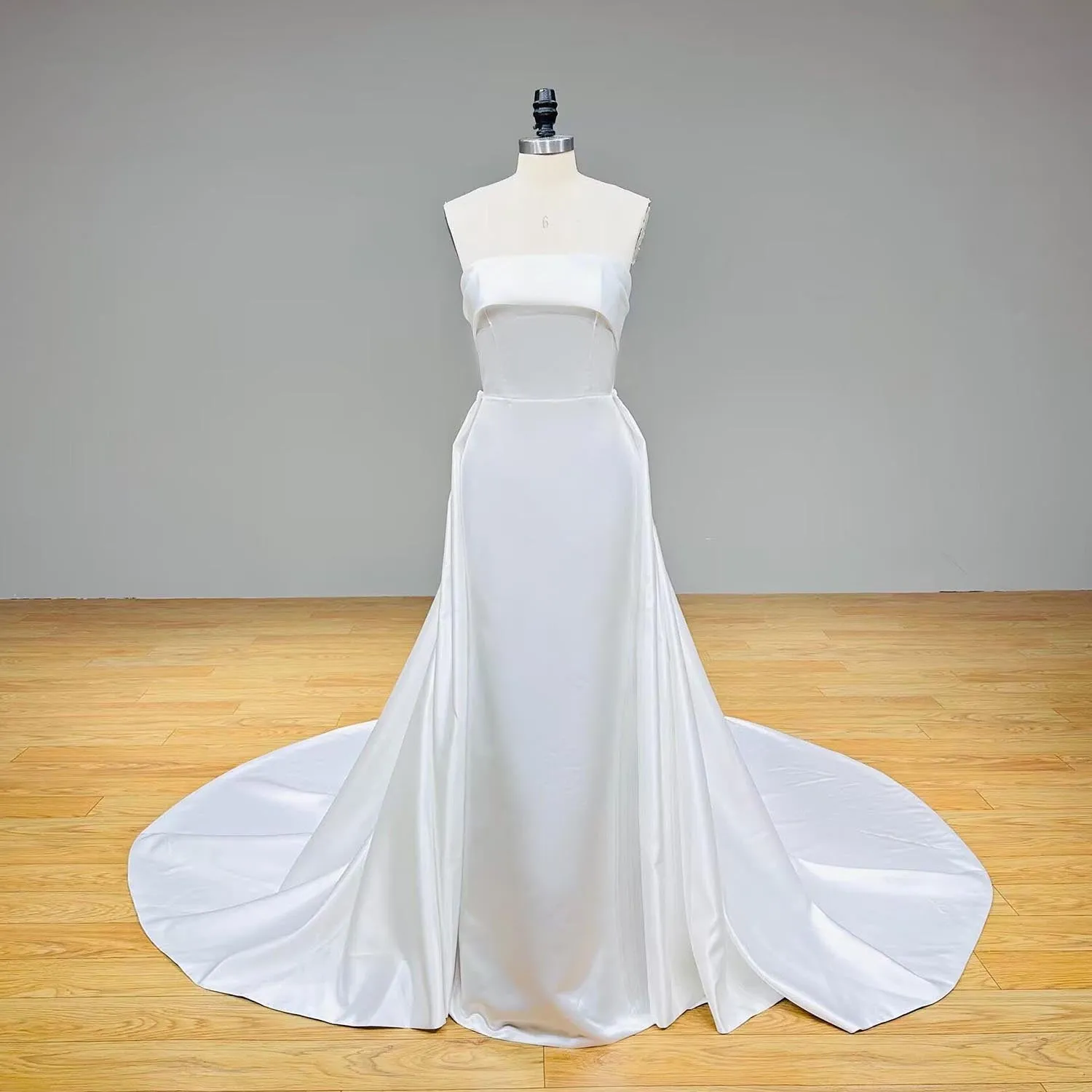 Elegant Satin Mermaid Wedding Dress with Detachable Train and Bow Back for a Modern Bridal Look